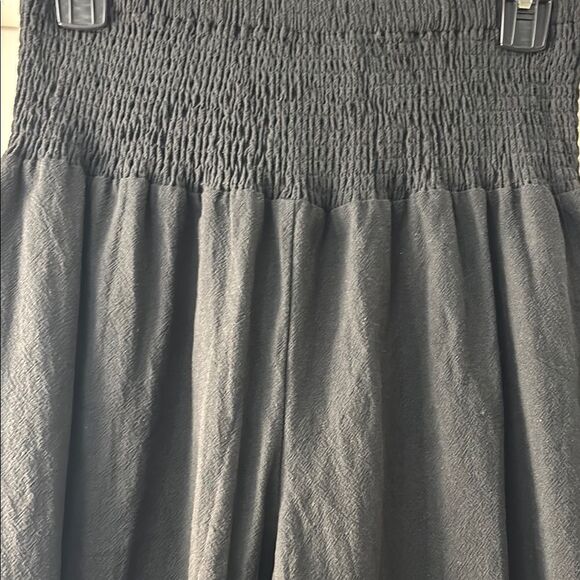 Black Ruffle Hem Wide-Leg Gaucho Pants. Elastic waist and ruffle hemline - Picture 3 of 11